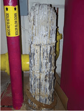 Laboratory heat exchanger after 21 days of untreated 20 gpg water, heavily encrusted with calcium scale